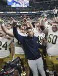 Marcus Freeman becomes first Asian American to coach a college football championship game